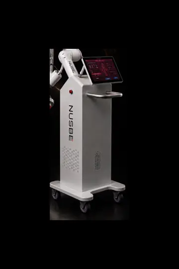 White NUSBE machine body with a partial articulated arm, display screen, vertical NUSBE mark and wheeled base